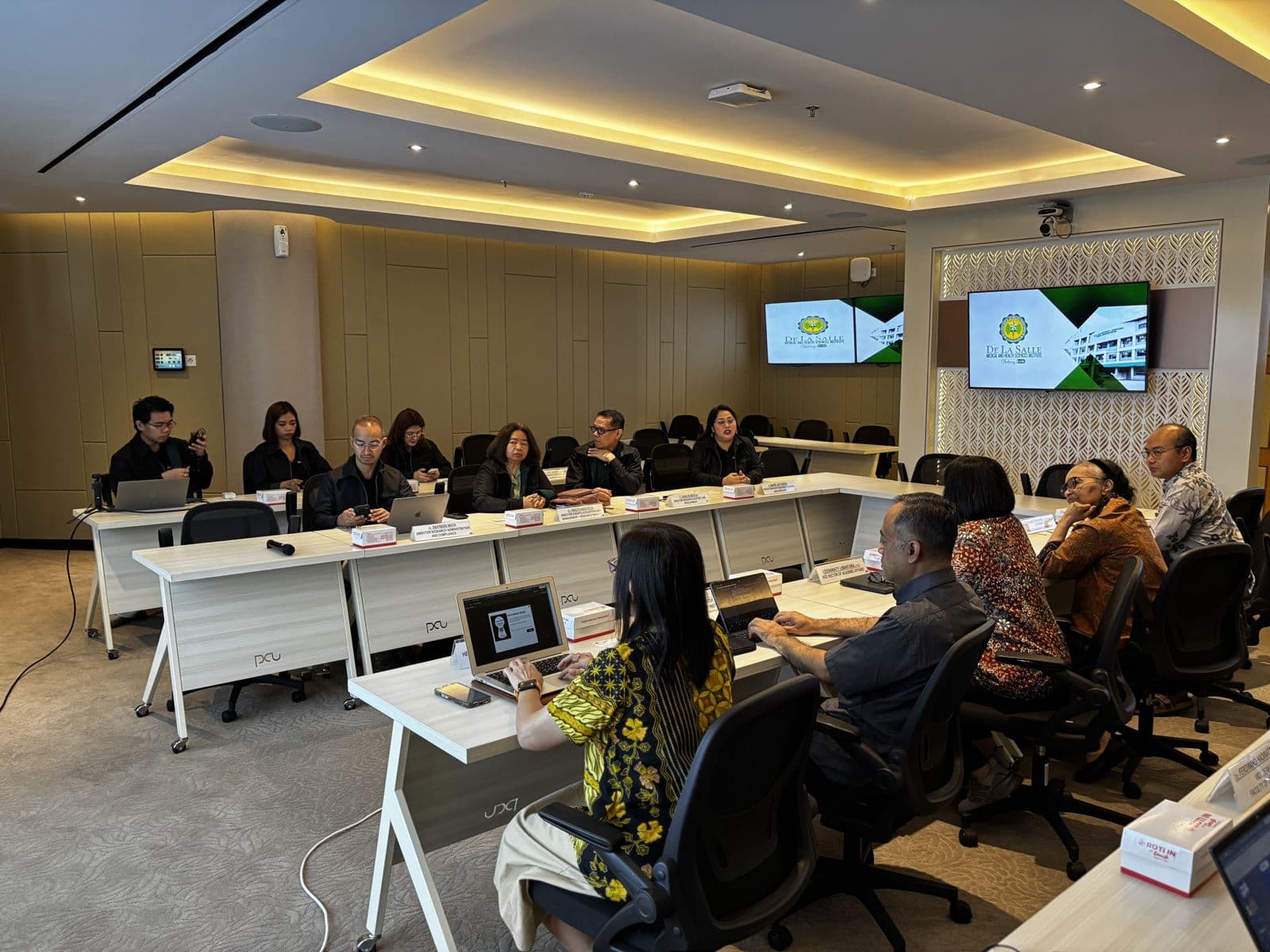 De La Salle University and PETRA delegations in a meeting room